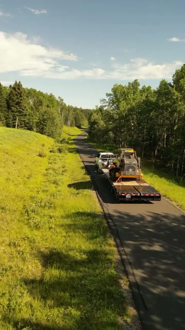 Second aerial pass following the load along the foothills two-lane.
