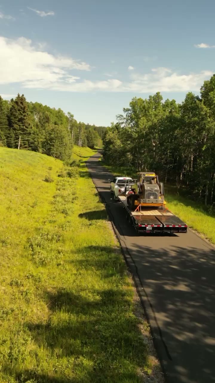 Second aerial pass following the load along the foothills two-lane